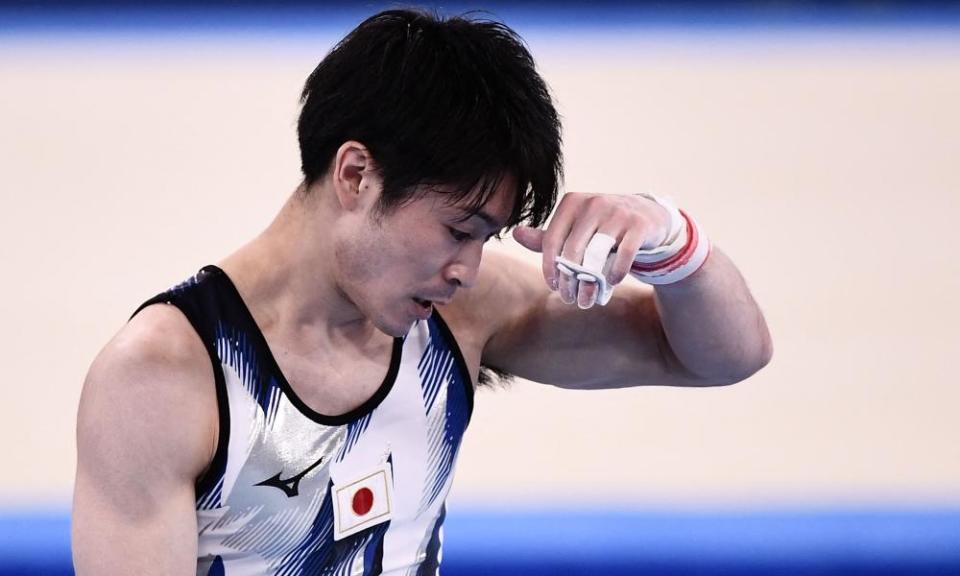 Japan’s Kohei Uchimura reacts after competing in the horizontal bars event of the gymnastics.