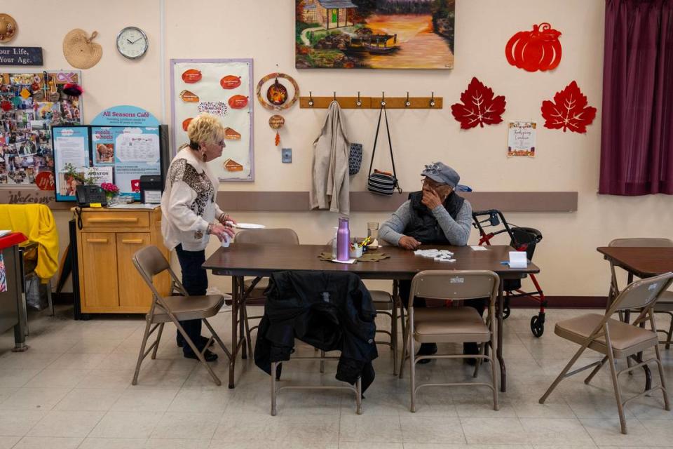 Darlene Baker, left, and Ruth Stanley, regulars at the Stanford Settlement senior center visit together earlier this month. About 50 seniors are served continental breakfast and a hot lunch every day and their existing sink is not adequate for its current use.