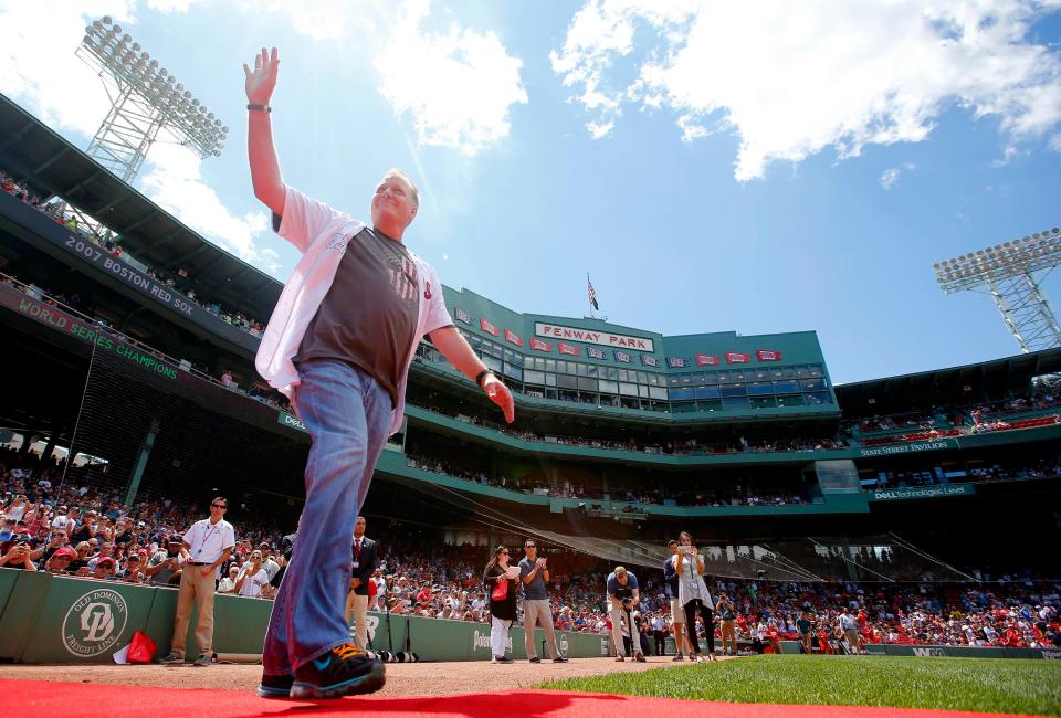 Schilling waves to fans at Fenway Park in 2017.