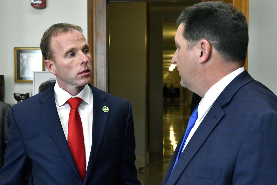 FILE - In a Tuesday, Jan. 8, 2019 file photo, Kentucky state Rep. Robert Goforth, R-East Bernstadt, left, speaks with running mate Lawrence County Attorney Mike Hogan after officially filing for governor at the Kentucky State Capitol in Frankfort, Ky. Undaunted by his status as a political underdog, state Goforth has logged more than 10,000 miles in his pickup truck and invested at least $750,000 of his own money into challenging Kentucky’s governor in the state’s Republican primary. (AP Photo/Timothy D. Easley, File)