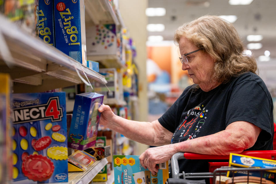 AUSTIN, TEXAS - DECEMBER 21: A customer shops for holiday gifts in a Target store on December 21, 2023 in Austin, Texas. People continue last-hour shopping and preparations as the holiday season draws nearer. (Photo by Brandon Bell/Getty Images)