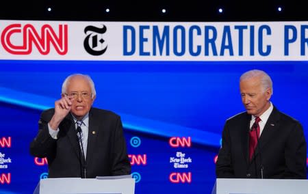 Democratic presidential candidate Sanders speaks as former Vice President Biden listens during the fourth U.S. Democratic presidential candidates 2020 election debate at Otterbein University in Westerville, Ohio U.S.