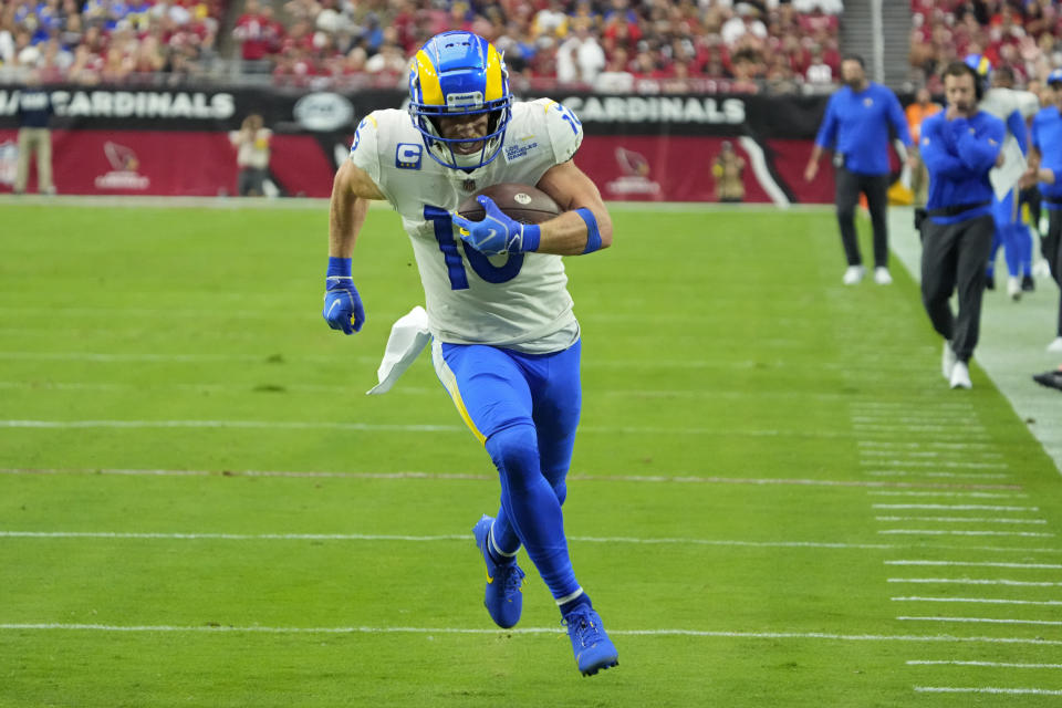 Los Angeles Rams wide receiver Cooper Kupp (10) runs for a touchdown against the Arizona Cardinals during the first half of an NFL football game, Sunday, Sept. 25, 2022, in Glendale, Ariz. (AP Photo/Rick Scuteri)