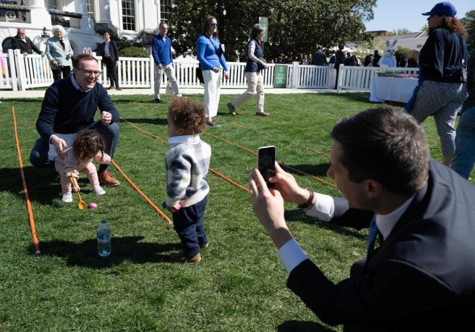 Pete Buttigieg and Chasten Buttigieg with their twins at the White House Easter Egg Roll