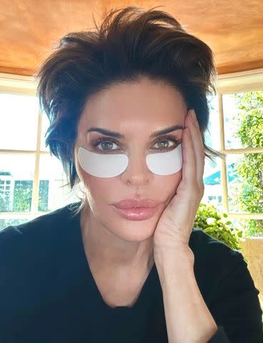 <p>Courtesy of Rinna Beauty</p> Lisa Rinna using her Bright Eyes Refreshing Under Eye Gel Cooling Patches