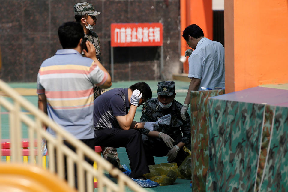 <p>Investigators work at the scene of an explosion inside a kindergarten in Fengxian County in Jiangsu Province, China , June 16, 2017. (Photo: Aly Song/Reuters) </p>