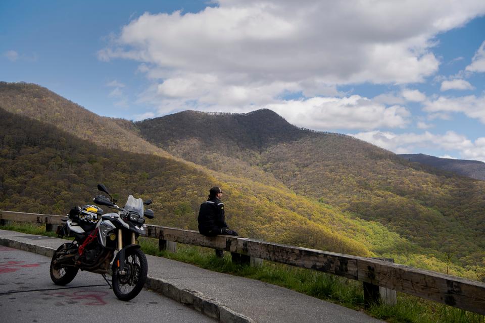 Jason takes in the view along the Blue Ridge Parkway while taking a break from riding his motorcycle May 1, 2023.