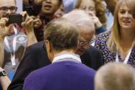 Warren Buffett talks with Bill Gates (L) before participating in the newspaper tossing challenge at the Clayton Home in the exhibit hall during the Berkshire Hathaway Annual Shareholders Meeting at the CenturyLink Center in Omaha, Nebraska, U.S. April 30, 2016. REUTERS/Ryan Henriksen