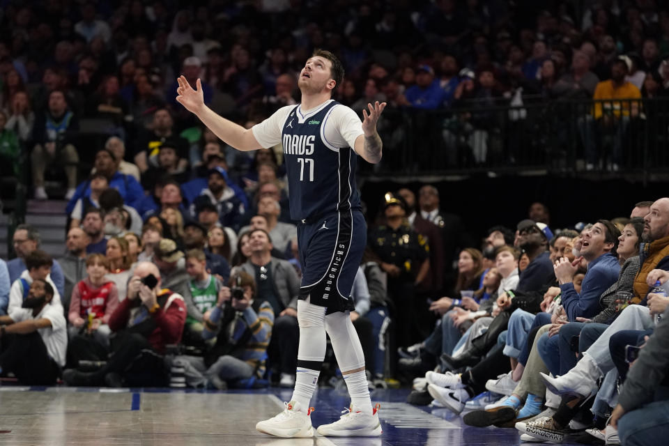 Dallas Mavericks guard Luka Doncic (77) reacts after watching a replay during the second half of an NBA basketball game against the Los Angeles Clippers in Dallas, Sunday, Jan. 22, 2023. (AP Photo/LM Otero)
