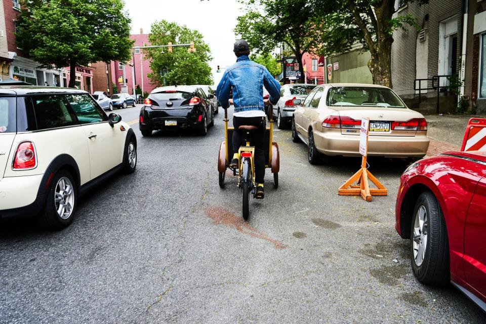 riding an ebike cargo bike in traffic in philadelphia