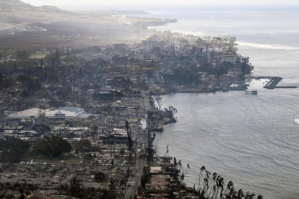 TOPSHOT - An aerial image taken on August 10, 2023 shows destroyed homes, buildings, and the harbor area burned to the ground in Lahaina in the aftermath of wildfires in western Maui, Hawaii. At least 36 people have died after a fast-moving wildfire turned Lahaina to ashes, officials said August 9, as visitors asked to leave the island of Maui found themselves stranded at the airport. The fires began burning early August 8, scorching thousands of acres and putting homes, businesses and 35,000 lives at risk on Maui, the Hawaii Emergency Management Agency said in a statement. 