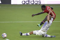 Orlando City defender Robin Jansson, front, defends against a shot attempt by Toronto FC midfielder Richie Laryea (22) during the first half of an MLS soccer match Saturday, June 19, 2021, in Orlando, Fla. (AP Photo/Phelan M. Ebenhack)