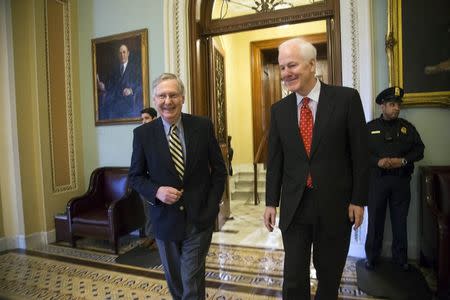 U.S. Senate Majority Leader Mitch McConnell (R-KY) (L) and Majority Whip Senator John Cornyn (R-TX) smile as they leave the Senate floor following votes on Department of Homeland Security funding at the Capitol in Washington, February 27, 2015. REUTERS/Jonathan Ernst