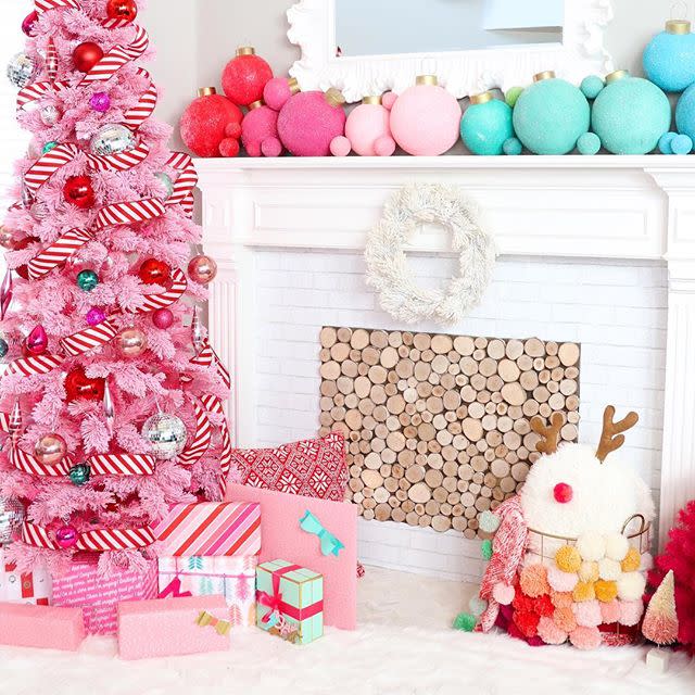 <p>If you want proof red and pink <em>do </em>belong together, look no further than this tree. The candy cane-inspired ribbon ensures pink flocking still feels festive.</p>