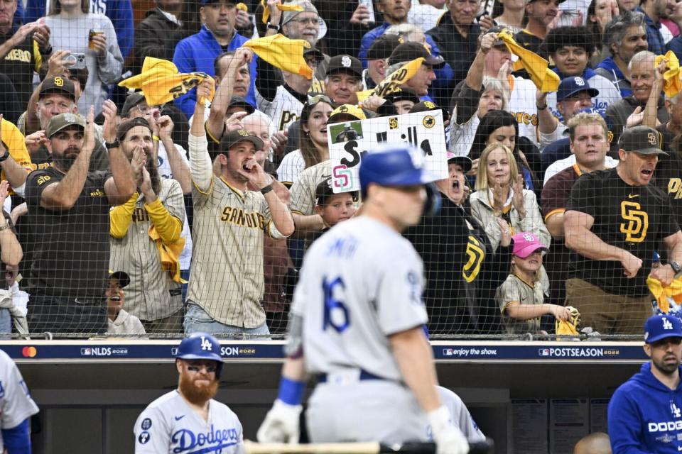 San Diego Padres fans cheer after Dodgers batter Will Smith strikes out in Game 3 of the NLDS in October.