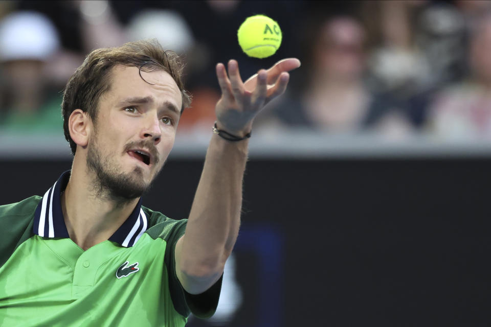 Daniil Medvedev of Russia serves to Felix Auger-Aliassime of Canada during their third round match at the Australian Open tennis championships at Melbourne Park, Melbourne, Australia, Saturday, Jan. 20, 2024. (AP Photo/Asanka Brendon Ratnayake)