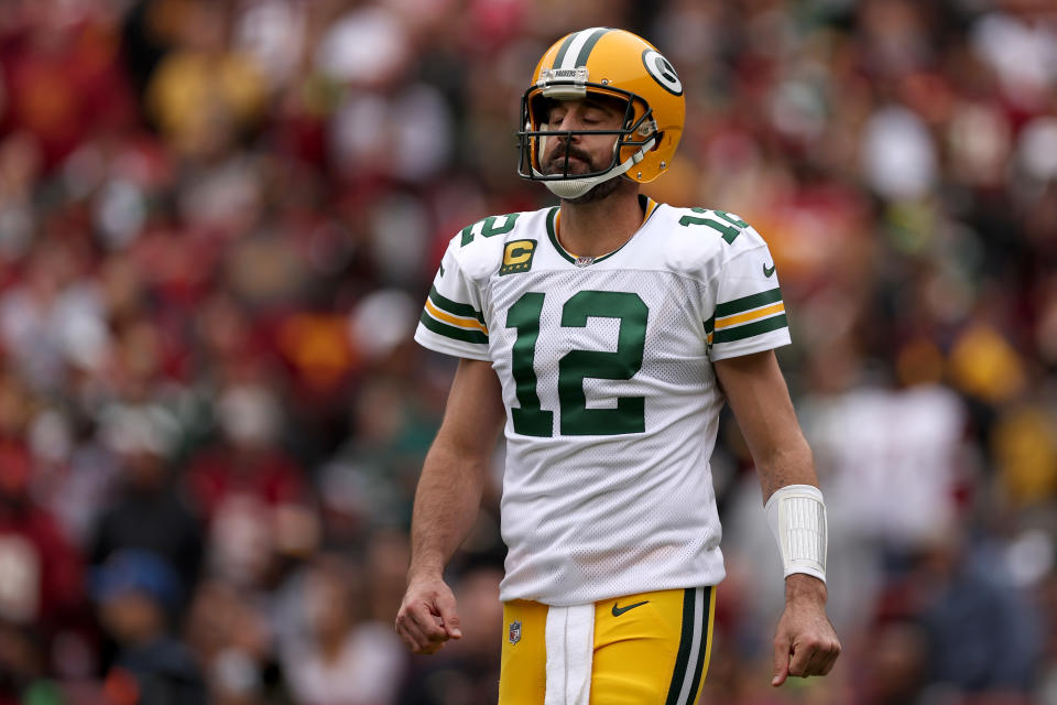 LANDOVER, MARYLAND - OCTOBER 23: Aaron Rodgers #12 of the Green Bay Packers reacts after a play during the first quarter of an NFL game against the Washington Commanders at FedExField on October 23, 2022 in Landover, Maryland. (Photo by Scott Taetsch/Getty Images)