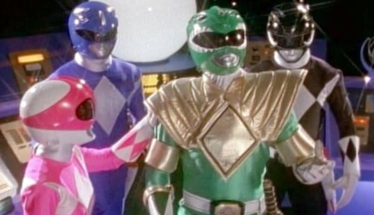 The pink,  blue, green, and black rangers stand together