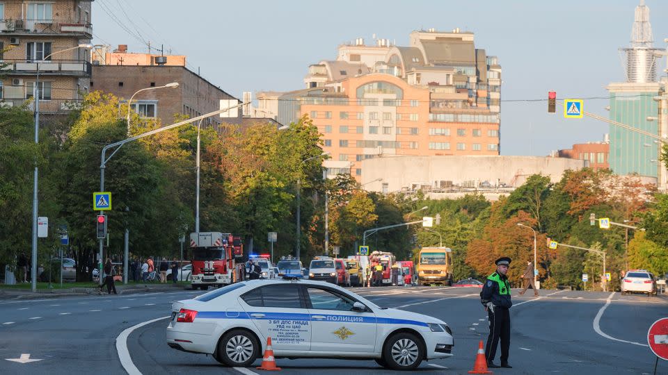 A police officer blocks a road following a reported drone attack in central Moscow on July 24, 2023.  - Shamil Zhumatov/Reuters