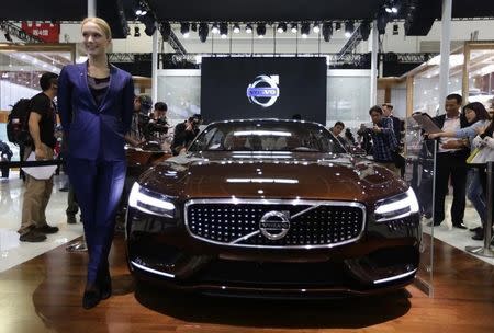 A model poses with a Volvo concept car at Auto China 2014 in Beijing April 20, 2014. REUTERS/Jason Lee