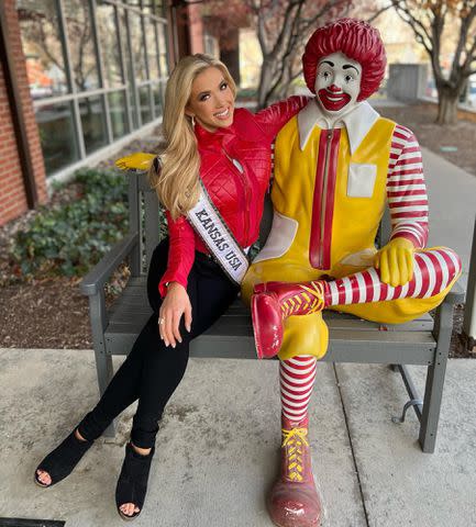 <p>Gracie Hunt Instagram</p> Clark Hunt's daughter Gracie Hunt with a statue of Ronald McDonald.
