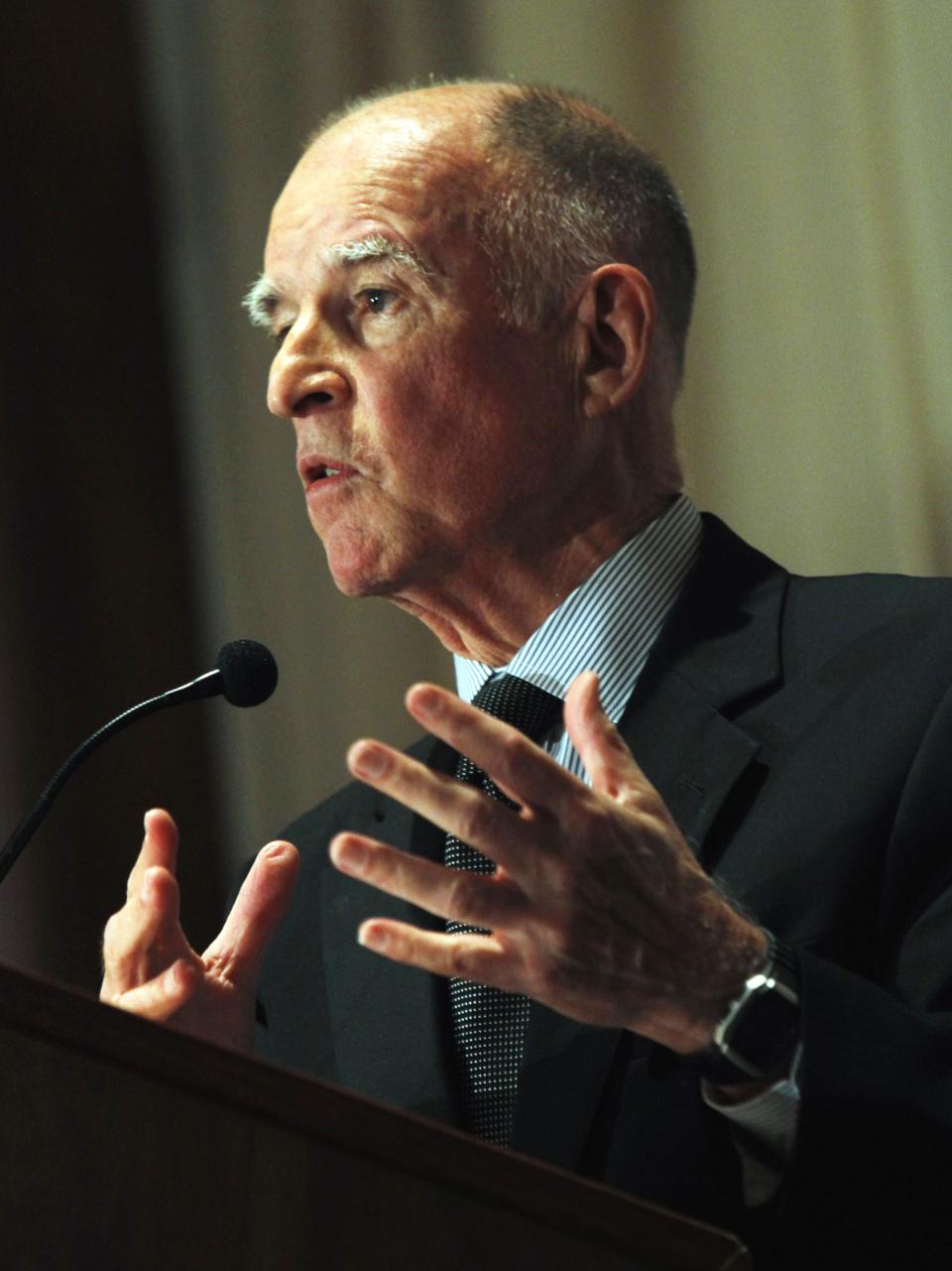 Gov. Jerry Brown warns of painful cuts in Sacramento unless voters approve his $6 billion-a-year tax increase as he speaks in Los Angeles on Wednesday, Oct. 31, 2012. Recent polling has found Proposition 30 in danger of failing in Tuesday's election. (AP Photo/Nick Ut)