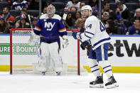 Toronto Maple Leafs defenseman Morgan Rielly (44) skates to his bench after scoring a goal past New York Islanders goaltender Ilya Sorokin in the second period of an NHL hockey game Saturday, Jan. 22, 2022, in Elmont, N.Y. (AP Photo/Adam Hunger)