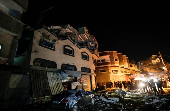 Palestinians inspect the damaged house of Islamic Jihad leader Baha Abu al-Ata afther an Israeli attack in Gaza city (AFP/Getty)