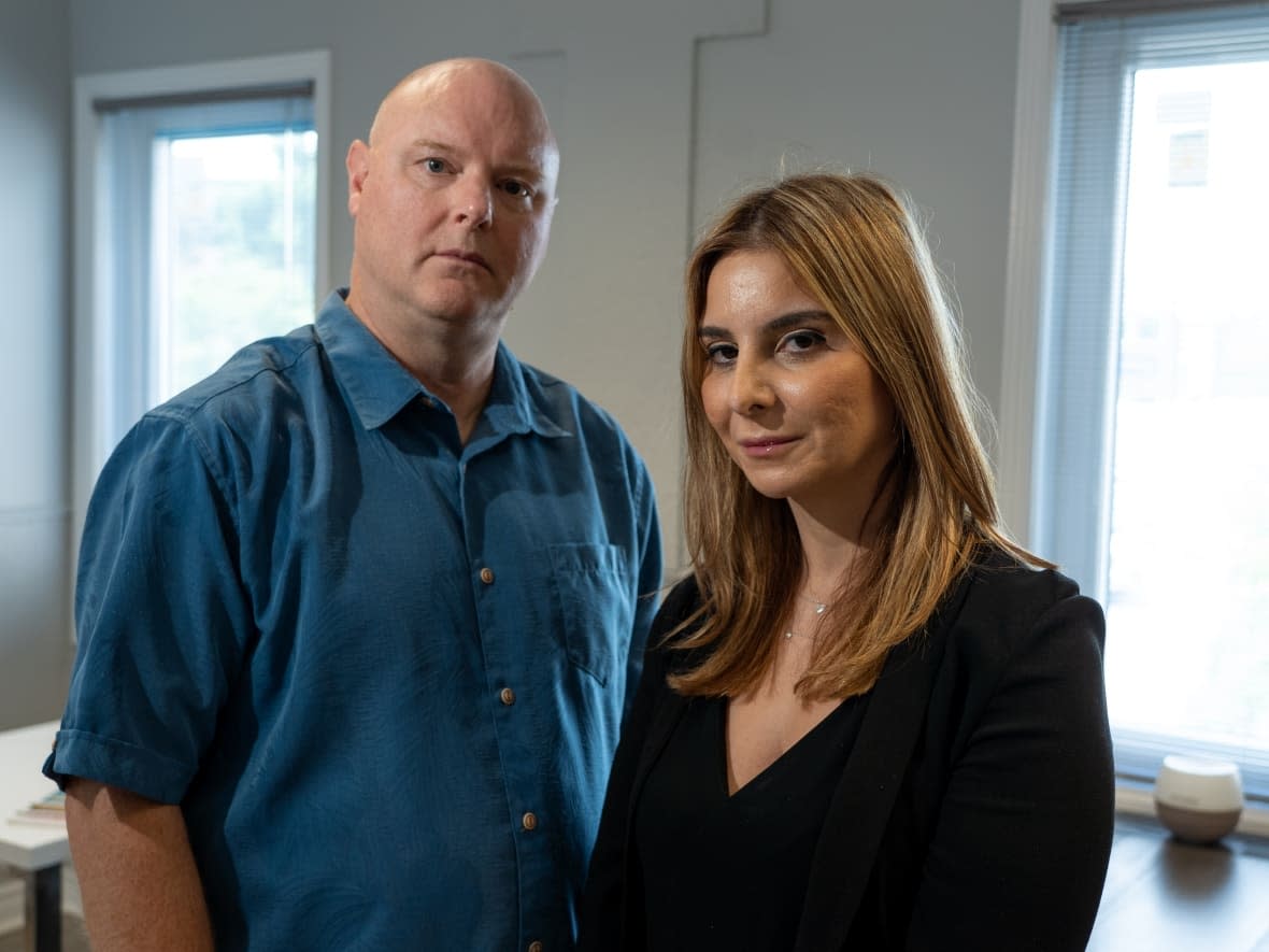 Cory Moore, left, is a former military legal officer with the Canadian Armed Forces. Tamar Boghossian, right, is an Ottawa immigration lawyer. With Boghossian's help, Moore is assisting 12 Afghans to apply for the special immigration program Canada set up for them last year, but is still waiting for answers. (Francis Ferland/CBC - image credit)