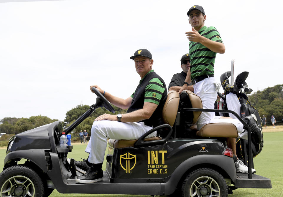 International team captain Ernie Els, left and Joaquin Niemann of Chile during a practice round ahead of the President's Cup Golf tournament in Melbourne, Wednesday, Dec. 11, 2019. (AP Photo / Andy Brownbill)