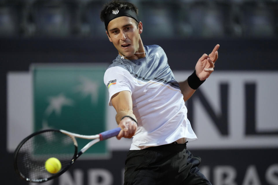 Argentina's Tomas Etcheverry returns the ball to Serbia's Novak Djokovic during their match at the Italian Open tennis tournament, in Rome, Friday, May 12, 2023. (AP Photo/Andrew Medichini)