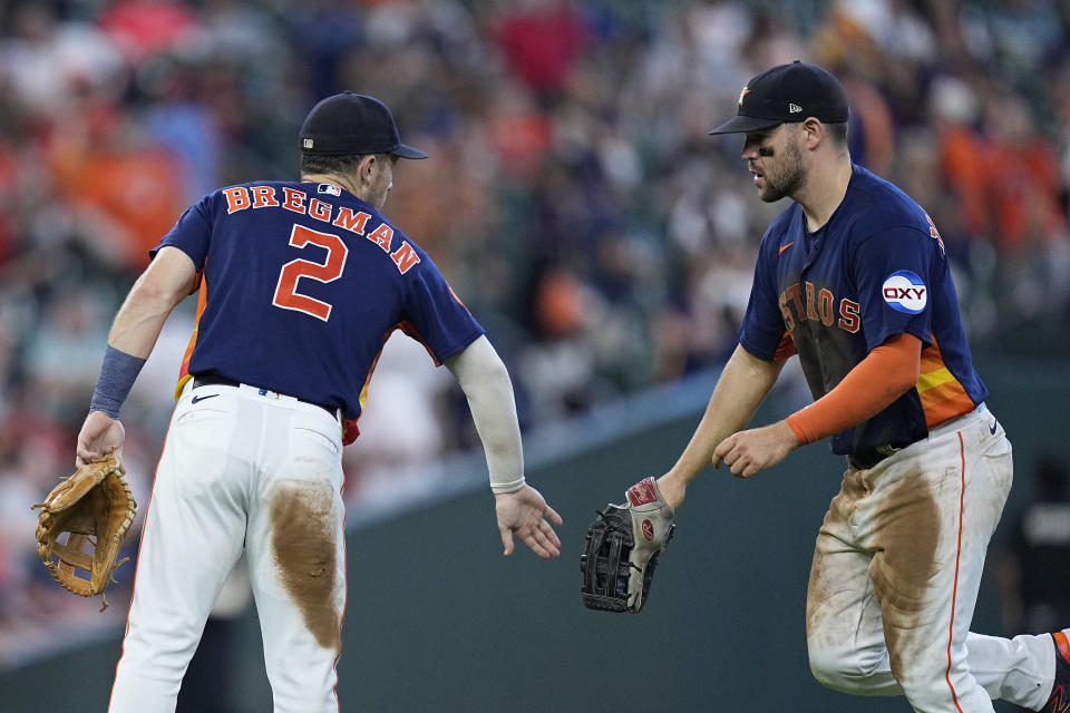 Houston Astros third baseman Alex Bregman (2) and center fielder Chas McCormick, right, celebrate after a baseball game against the San Diego Padres, Sunday, Sept. 10, 2023, in Houston. (AP Photo/Kevin M. Cox)