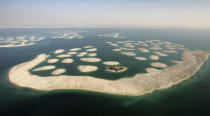 Contractor is already working in Patna. Eary this year, the Bihar State Housing Board (BSHB) selected him for the re-development of the housing board's flats here. (Pictured left: An aerial view of The World in Dubai. Photo by Chris Jackson/Getty Images)