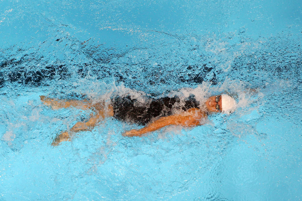 OMAHA, NE - JUNE 26: Natalie Coughlin competes in preliminary heat 17 of the Women's 100 m Backstroke during Day Two of the 2012 U.S. Olympic Swimming Team Trials at CenturyLink Center on June 26, 2012 in Omaha, Nebraska. (Photo by Jamie Squire/Getty Images)