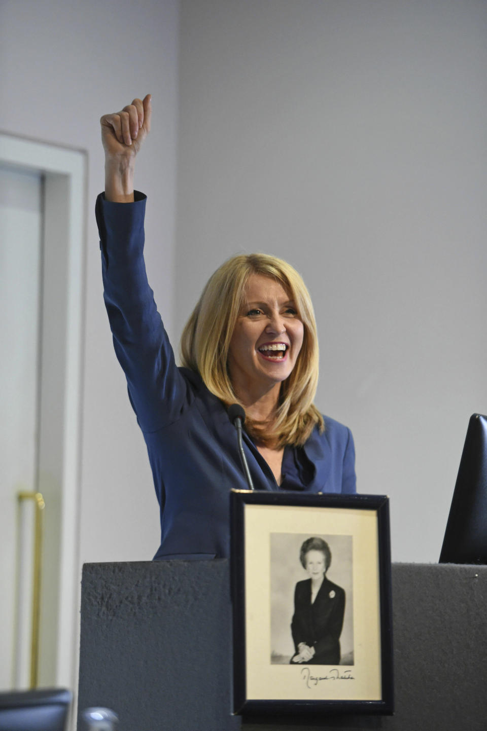 Conservative leadership hopeful Esther McVey gestures as she arrives for a Bruges Group meeting to discuss Brexit in London, Monday, June 10, 2019. Britain is set to get a new prime minister, but only members of the Conservative Party have a say in the decision. The Conservatives are holding an election to replace Prime Minister Theresa May, who resigned as party leader last week after failing to lead Britain out of the European Union on schedule. (David Mirzoeff/PA via AP)