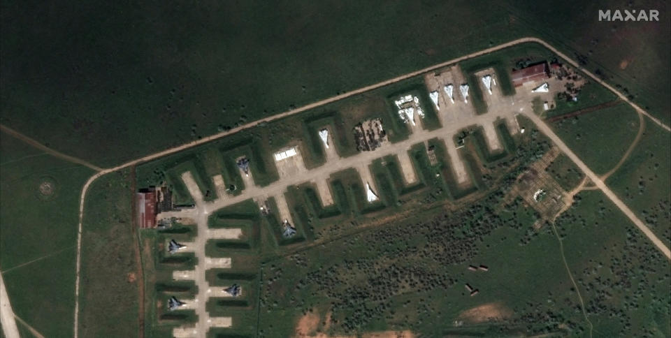 This satellite image provided by Maxar Technologies shows aircraft at Saki Air Base on May 16 2022, in the Crimean Peninsula, the Black Sea peninsula seized from Ukraine by Russia and annexed in March 2014. Ukraine's air force said Wednesday that nine Russian warplanes were destroyed in a deadly string of explosions at an air base in Crimea that appeared to be the result of a Ukrainian attack, which would represent a significant escalation in the war. (Satellite image ©2022 Maxar Technologies via AP)