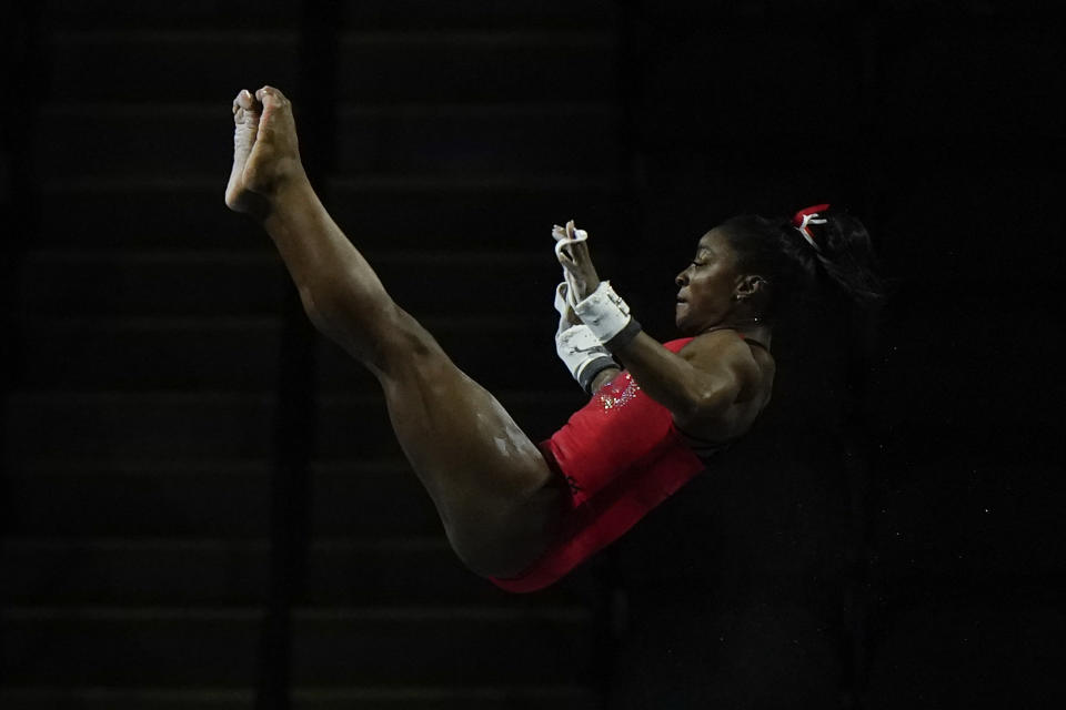 CAPTION CORRECTION CORRECTS SPORT: Simone Biles, a seven-time Olympic medalist and the 2016 Olympic champion, practices on the uneven bars at the U.S. Classic gymnastics competition Friday, Aug. 4, 2023, in Hoffman Estates, Ill. (AP Photo/Morry Gash)