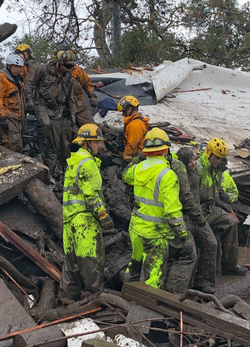 <p>Emergency personnel rescue a 14-year-old girl from a house after a mudslide in Montecito, Calif., Jan. 9, 2018. (Photo: Mike Eliason/Santa Barbara County Fire Department/Handout via Reuters) </p>