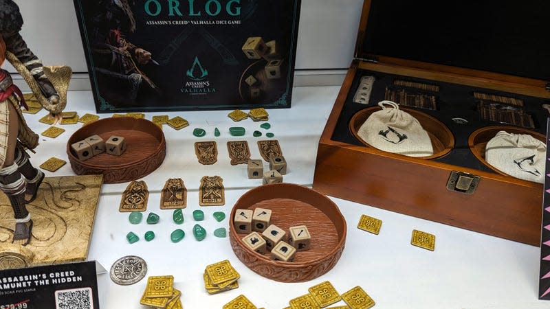 A playable game of Orlog is on display.