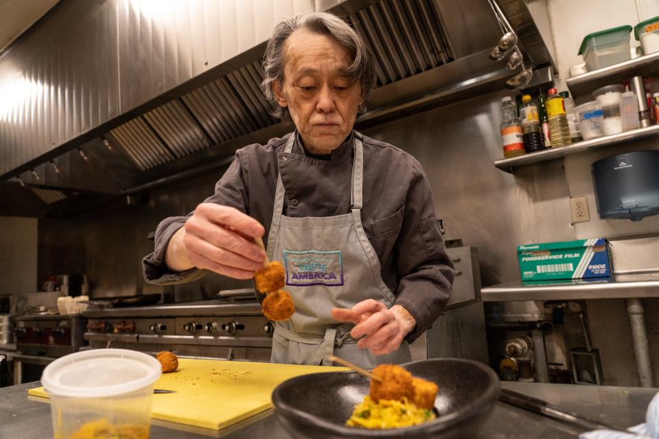 Chef Nobuo Fukuda prepares panko-fried tofu with green papaya salad and curry dressing at Hai Noon inside Sonder The Mariposa in Scottsdale on April 5, 2023.