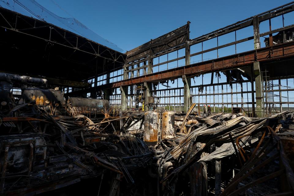 Employees work at a thermal power plant heavily damaged by recent Russian missile strikes in Ukraine