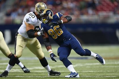 Michael Sam works against a Saints player. (Getty)