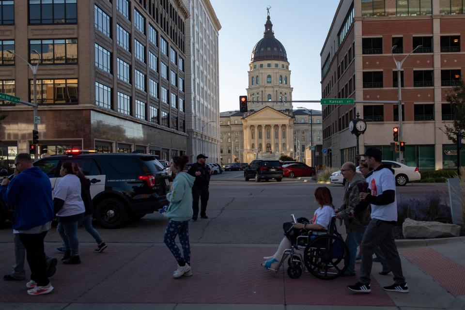 Participants march in support of Zoey Felix on Saturday in downtown Topeka as they urged better laws to protect children.