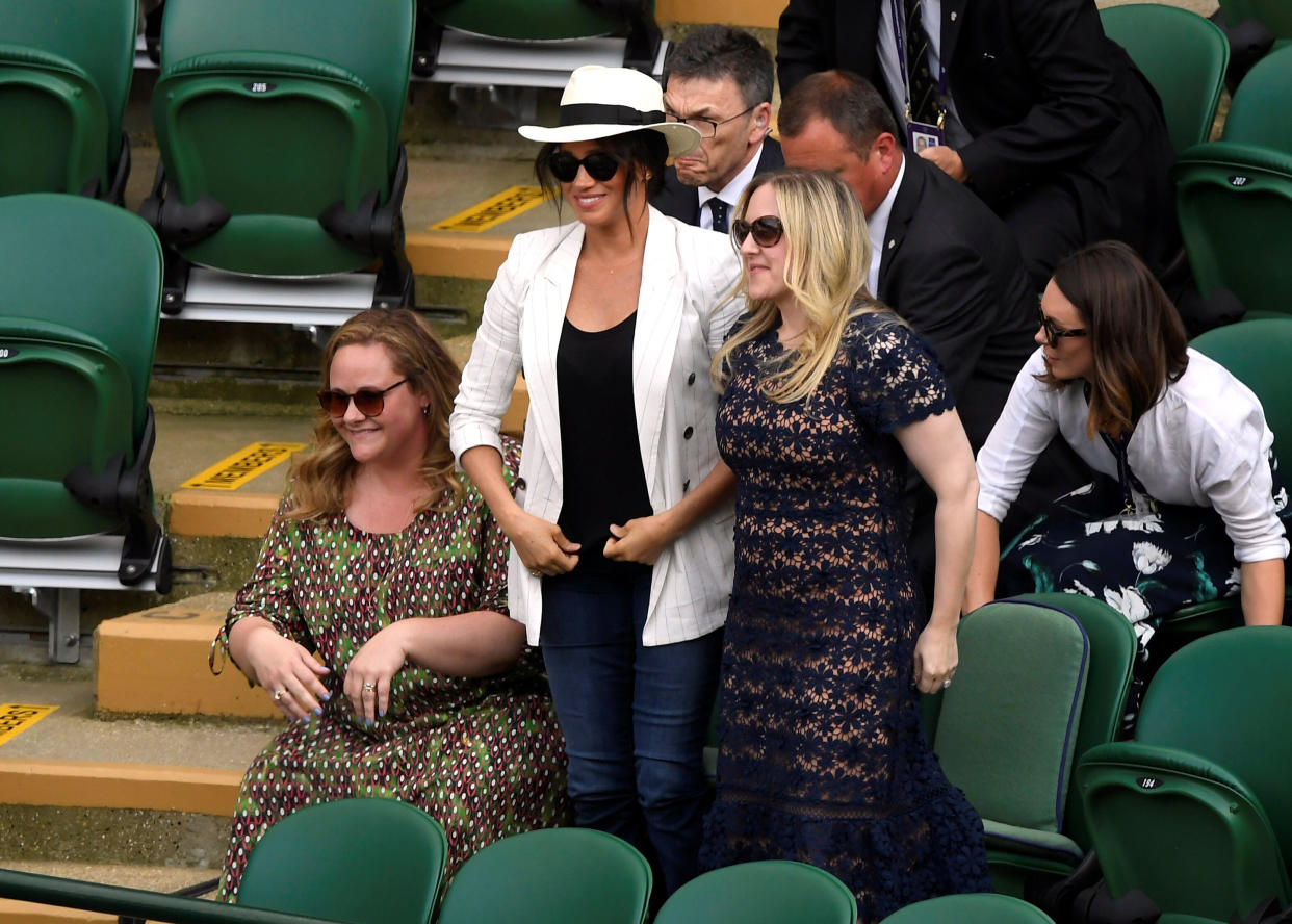 Meghan looks on as Serena Williams of the U.S. wins her second-round match against Slovenia's Kaja Juvan at Wimbledon.