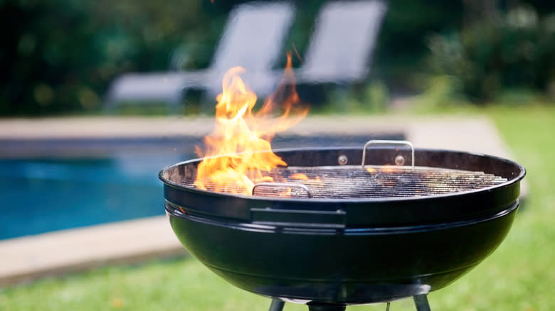 hot grill open flame in backyard