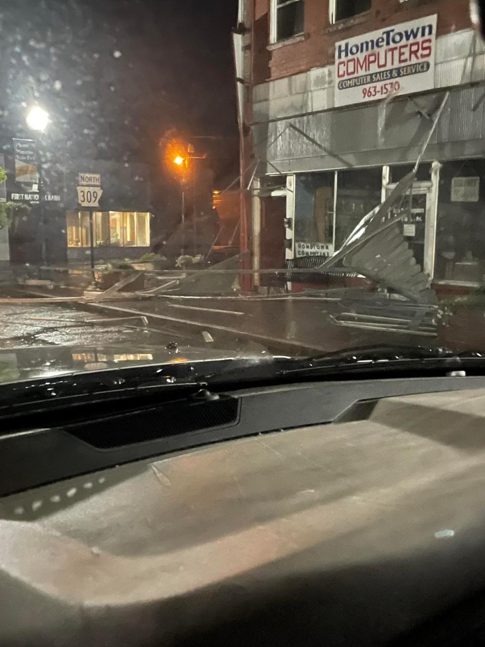 A sudden storm left damage late Sunday, July 17, 2022 in Paris, Arkansas.