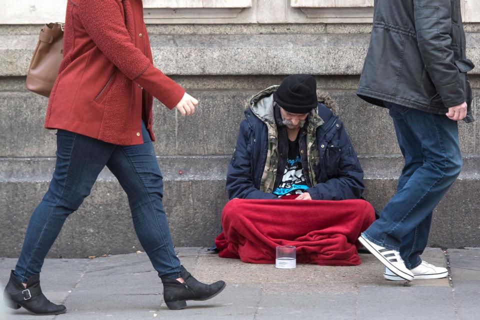 A homeless person outside Victoria Station in London: PA Wire/PA Images