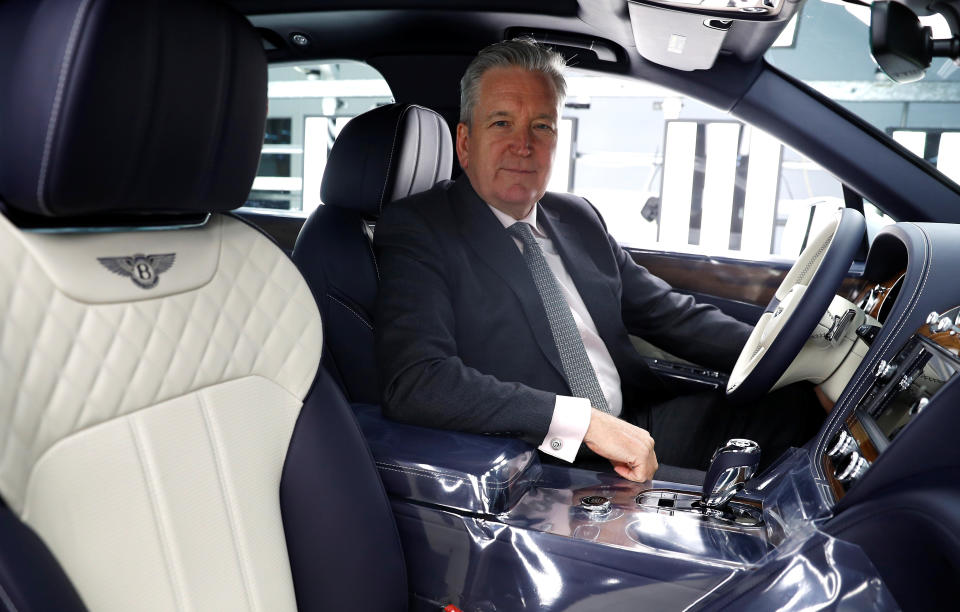 Adrian Hallmark, CEO of Bentley Motors, poses for a photograph inside one of his company's cars on the production line of their factory in Crewe, Britain January 22, 2019. REUTERS/Phil Noble