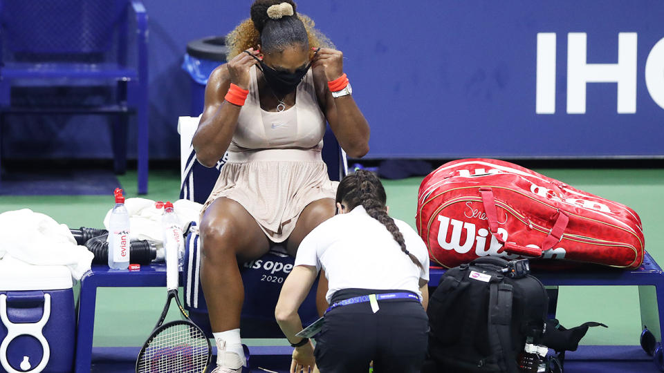 Serena Williams, pictured here having her ankle re-taped in the third set against Victoria Azarenka.