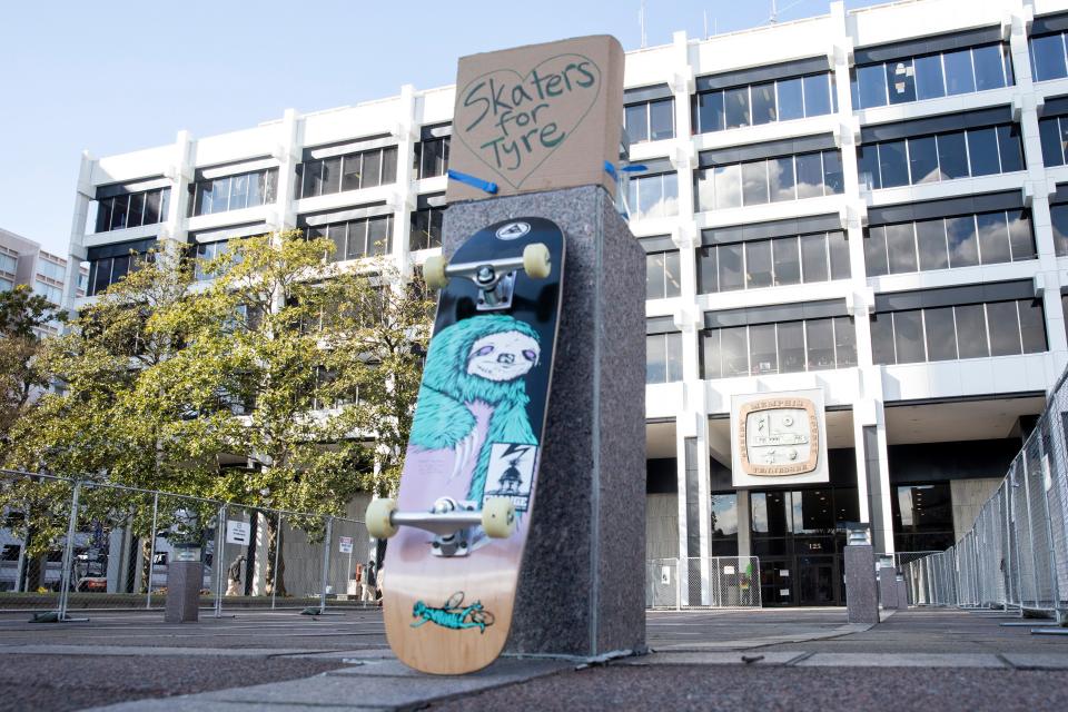 A skateboard and sign that reads “skaters for Tyre” are seen in front of Memphis City Hall in January. Nichols was known as an avid skateboarder.